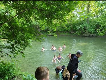 Teens playing in the river