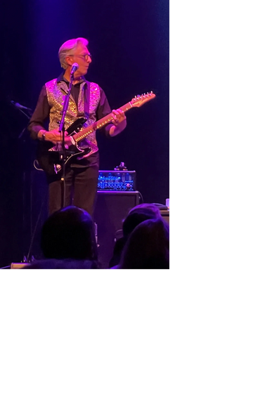 Joe Lombardi playing guitar live on stage