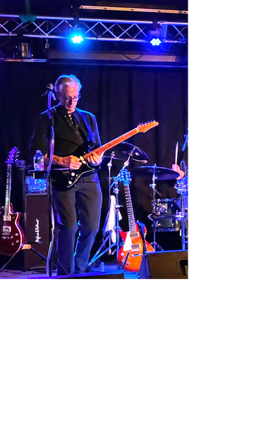 Joe Lombardi playing guitar live on stage