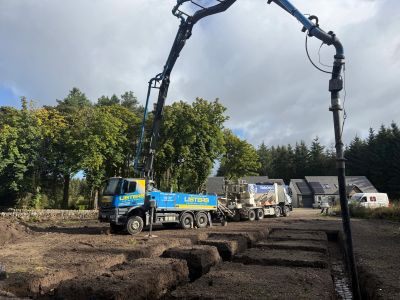 concrete pump, pumping concrete into foundations