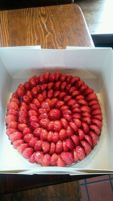 Strawberry Tart------ Glazed fresh strawberries with a rich almond crust