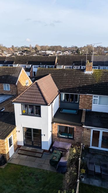 Aerial view of the completed two-storey extension and its tiled roof.