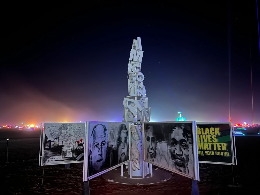 Nighttime art installation with social justice themes.