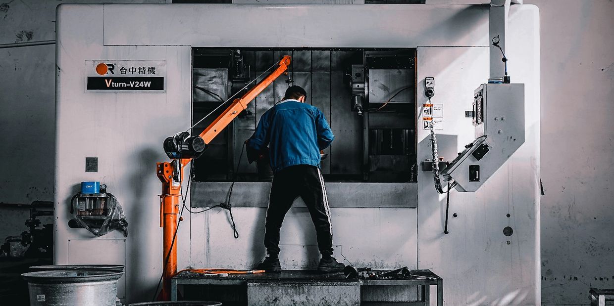 CNC operator working on forged wheels by MP Modular wheels