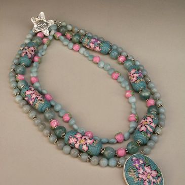Precious metal clay(.999 fine silver)and faux needlepoint  with Amazonite necklace in jewelry  shop.