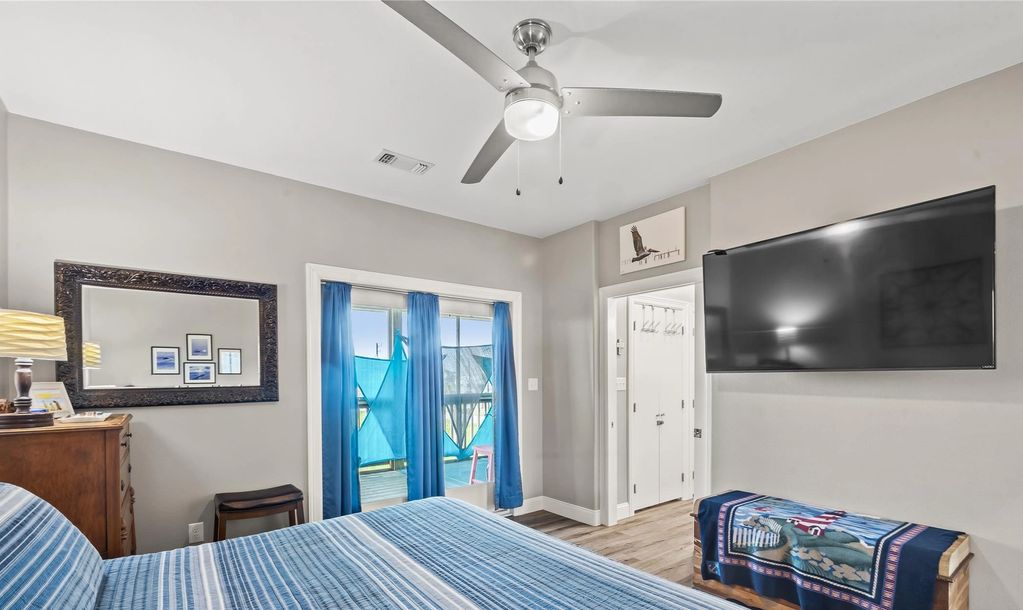 Master bedroom with a private entrance to the screened porch.
