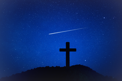 Cross with shooting star in background.