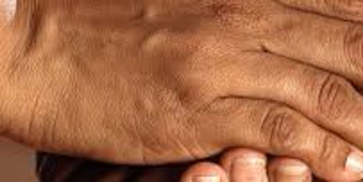 two people holding their hands