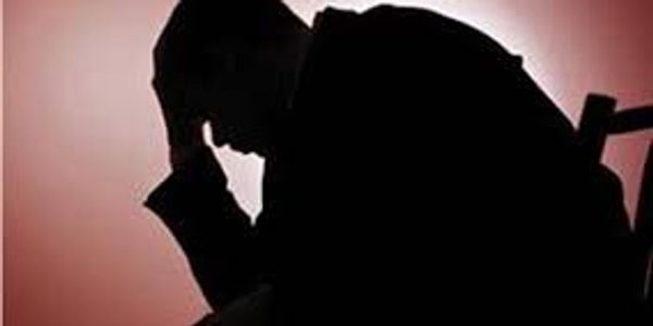 A man sitting in a depressed manner