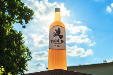 Tubi 60 bottle on a table outside