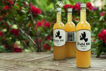 Tubi 60 bottles on a table outside