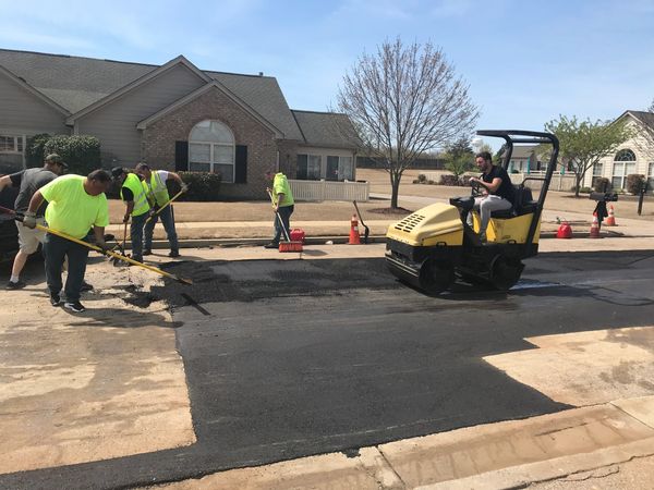 CPAC's crew repairing a damaged roadway in Memphis, TN with asphalt.