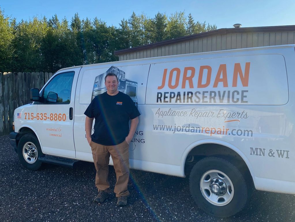 Man standing in front of a Jordan Repair Service van promoting appliance repair.