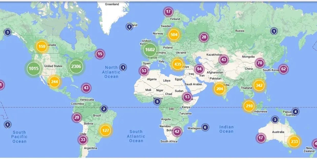 World map with colored data clusters representing numeric values.