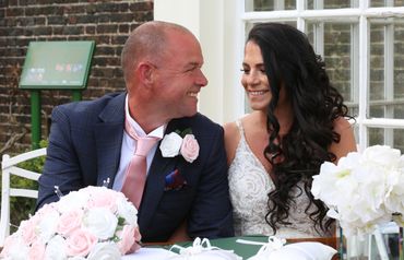 bride and groom sitting outside Langtons registry office