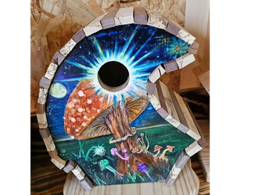 Decorative wooden birdhouse painted with a cosmic mushroom scene.