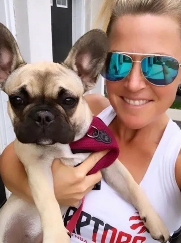 Doggy Steps Owner and Certified Dog Trainer holding a beautiful Frenchie!