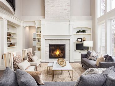 Bright living room with a cozy fireplace and modern furniture.