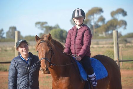 Mildura Horse Riding School participant with owner, Megan.