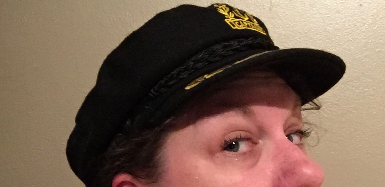 Tina in Captain's captain hat