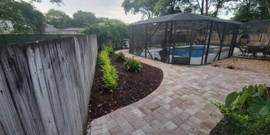 Belgard paver patio and walkway install with new landscaping plants.