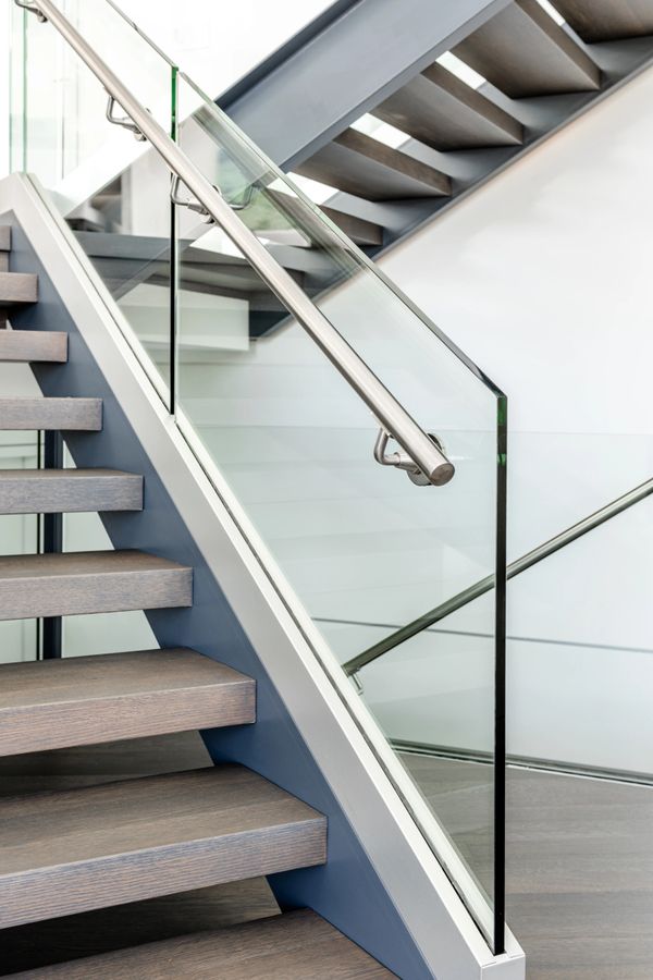 interior design renovated modern staircase with glass and stainless steel railing system 