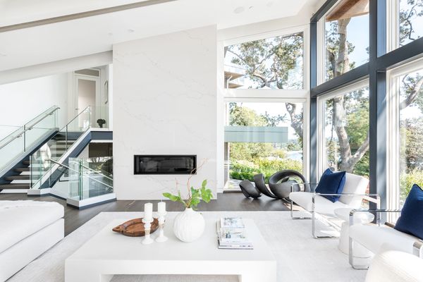 interior design new renovated modern living room with white quartz fireplace modern art and decor 