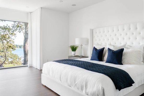 interior design modern master bedroom with Restoration Hardware upholstered bed in white 