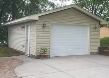 gregory contracting - tan detached one door garage