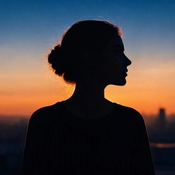 Silhouette of a woman at sunset.