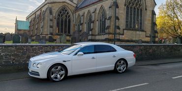 LEICESTER PLATINUM CHAUFFEURS BENTLEY FLYING SPUR AT CHURCH CIVIL WEDDING