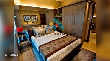 Cozy modern bedroom with a large bed, soft lighting, and elegant decor.