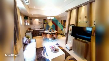 Cozy modern living and dining area with neutral tones and stylish decor.