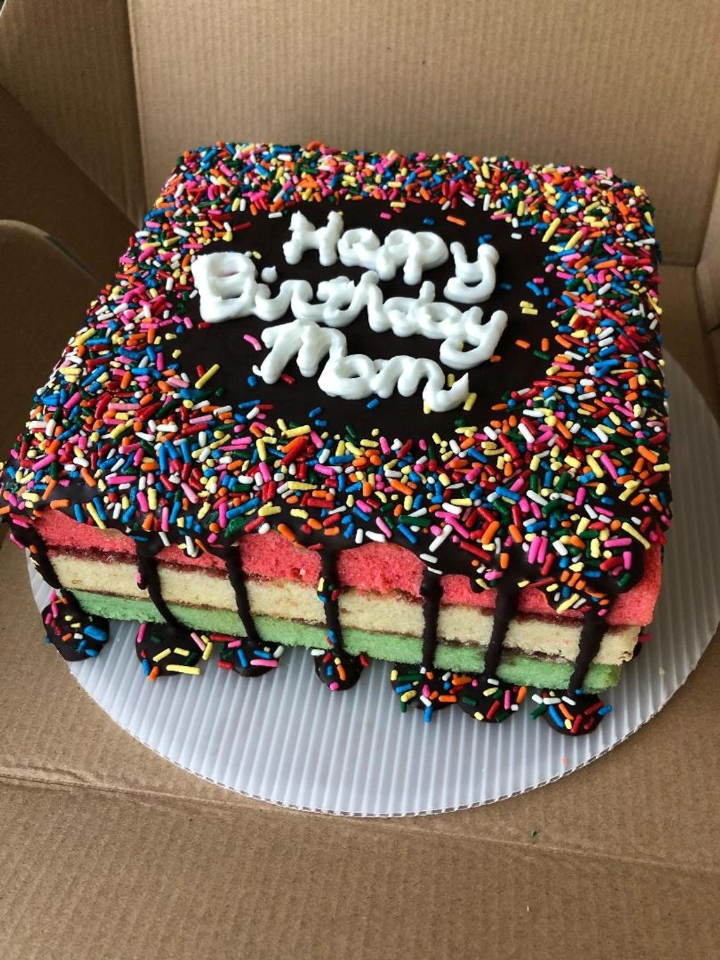Our Italian Rainbow Cookie Celebration Cake, made of almond paste, raspberry filling, and chocolate