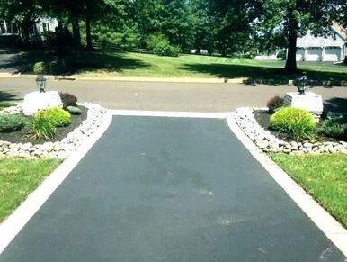 Image shows new asphalt driveway installed by our team in Toronto