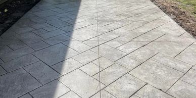 Image shows new concrete patio installed by our team in Toronto