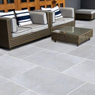 Natural stone pavers and steps installed using Banas Stones products in a residential back patio