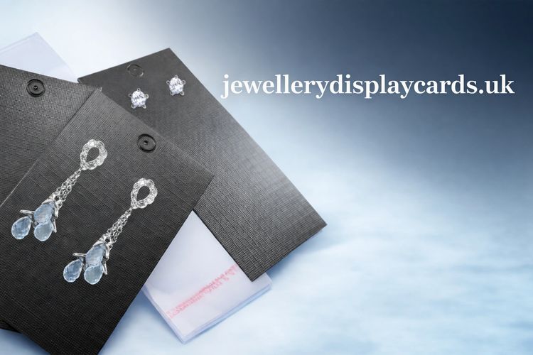 BLACK EARRING CARDS WITH BAGS ON A CLOUD BLUE BACKGROUND