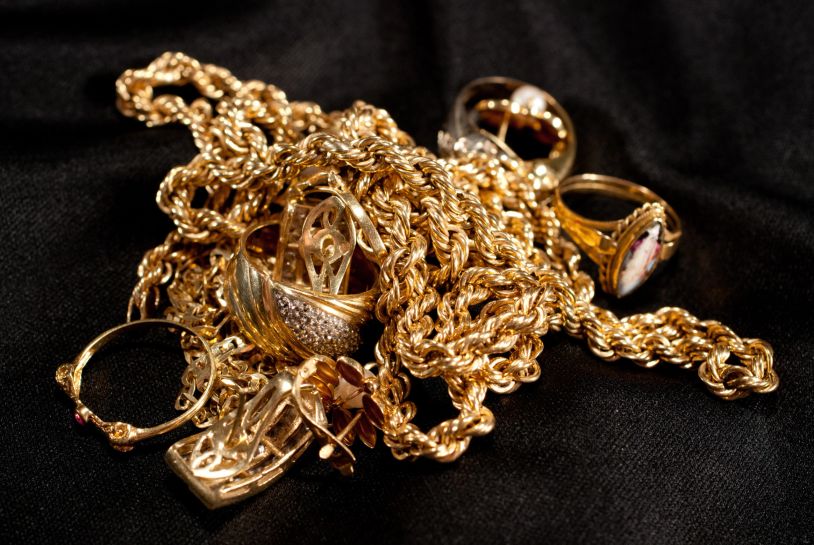 Assortment of gold jewelry including rings and chains