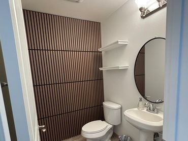 Amazing Acoustical paneling installed in the guest bathroom.