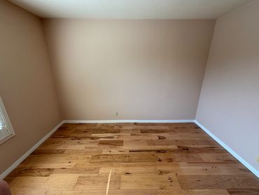 Beautiful hard wood flooring in guest bedroom. Next image shows the Furniture assembly of the two be