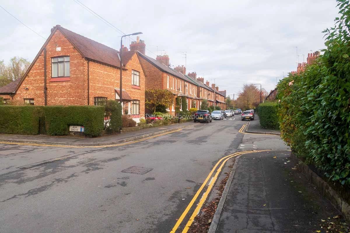 View of road with housing visible on left