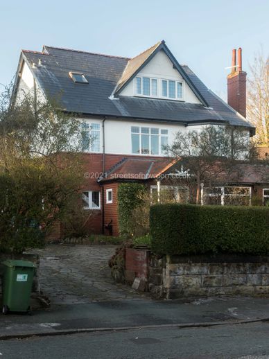 Detached house with prominent dormer
