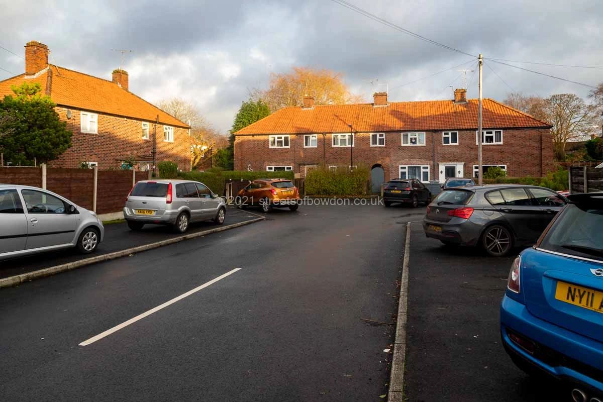 Cul de sac with cars parked on pavement
