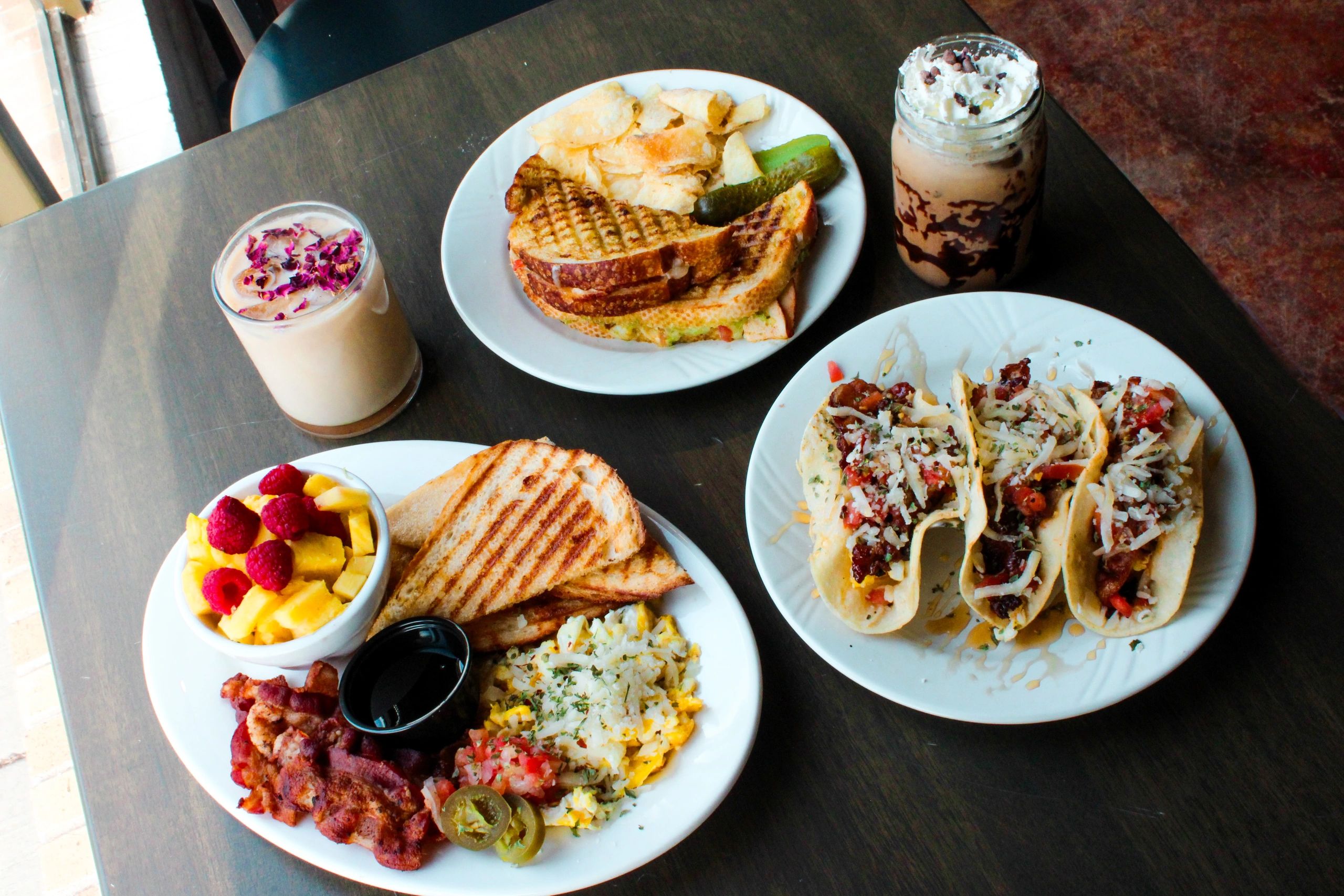 (Right to Left) Breakfast Tacos, Mocha, Pesto Aioli Panini Melt, Honey Lav., Breakfast Platter