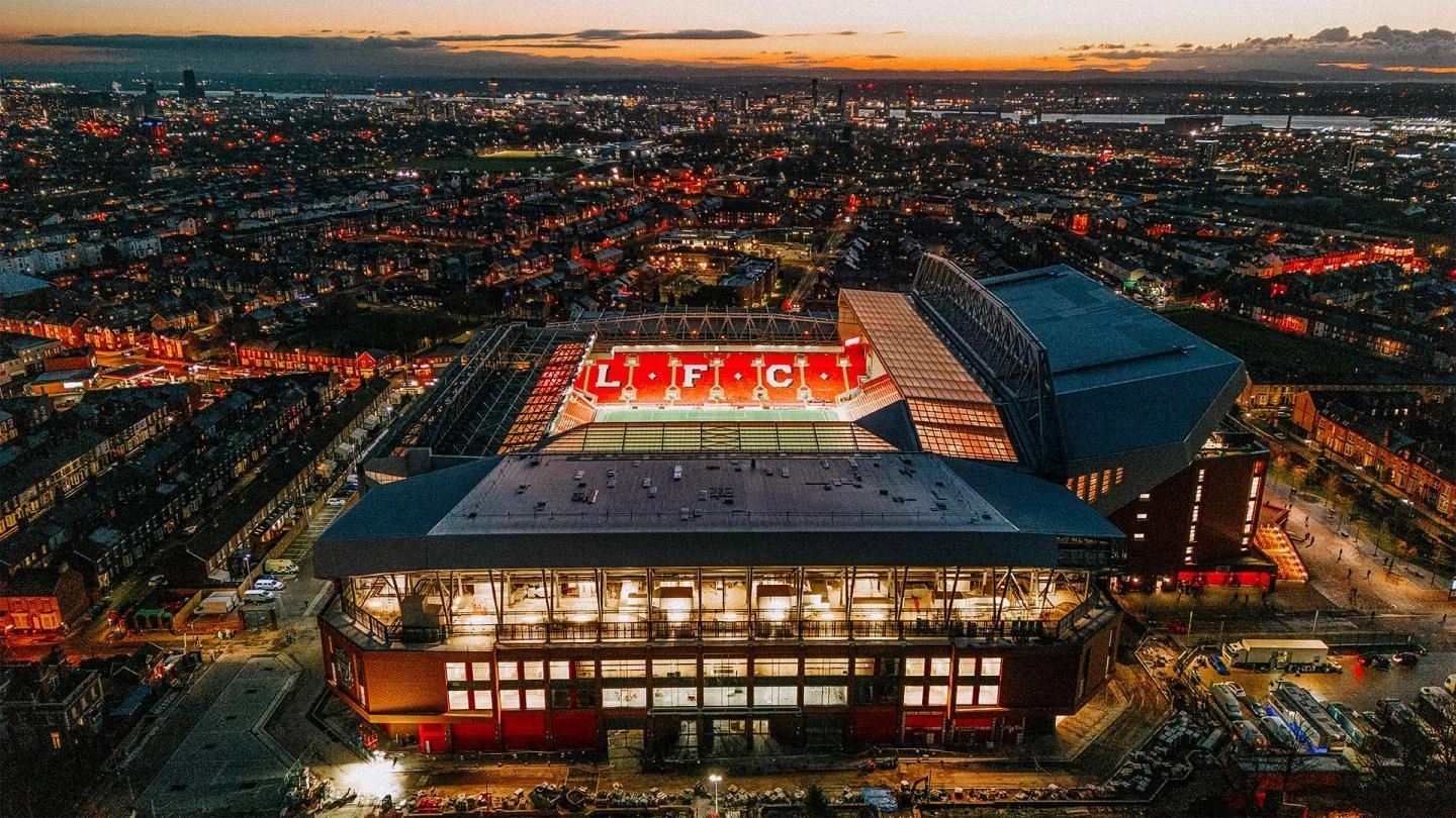 Aerial night view of Anfield Stadium illuminated in Liverpool.