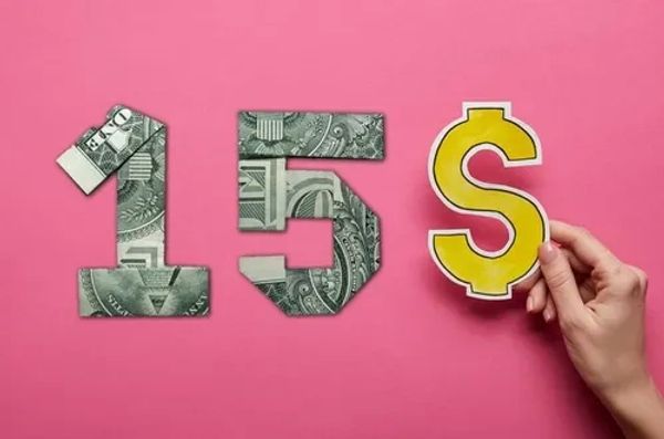 Numbers "15" made of dollar bills with a yellow dollar sign.