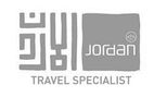 Logo for Jordan Travel Specialist featuring Arabic calligraphy and modern text.