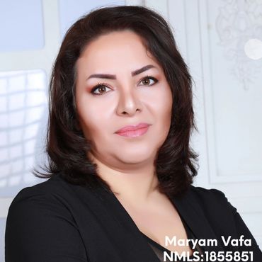Professional portrait of a woman with dark hair and makeup.
