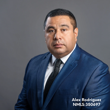 Professional portrait of a man in a blue suit.